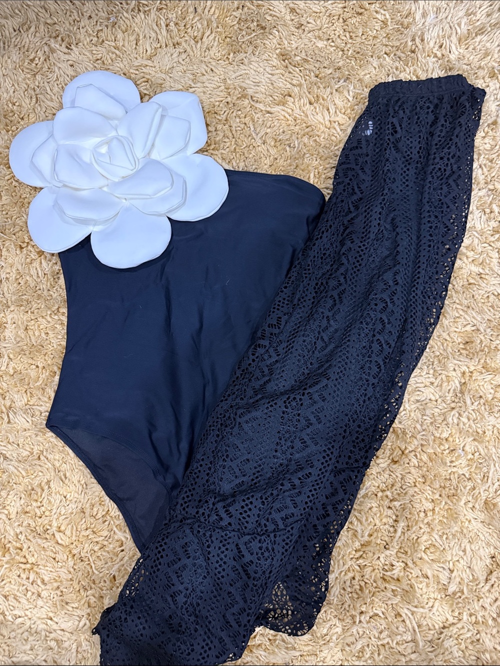 Black One-Piece Swimsuit with White Floral Accent